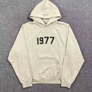 Fear of God Cream Hoodie with Black '1977' Print